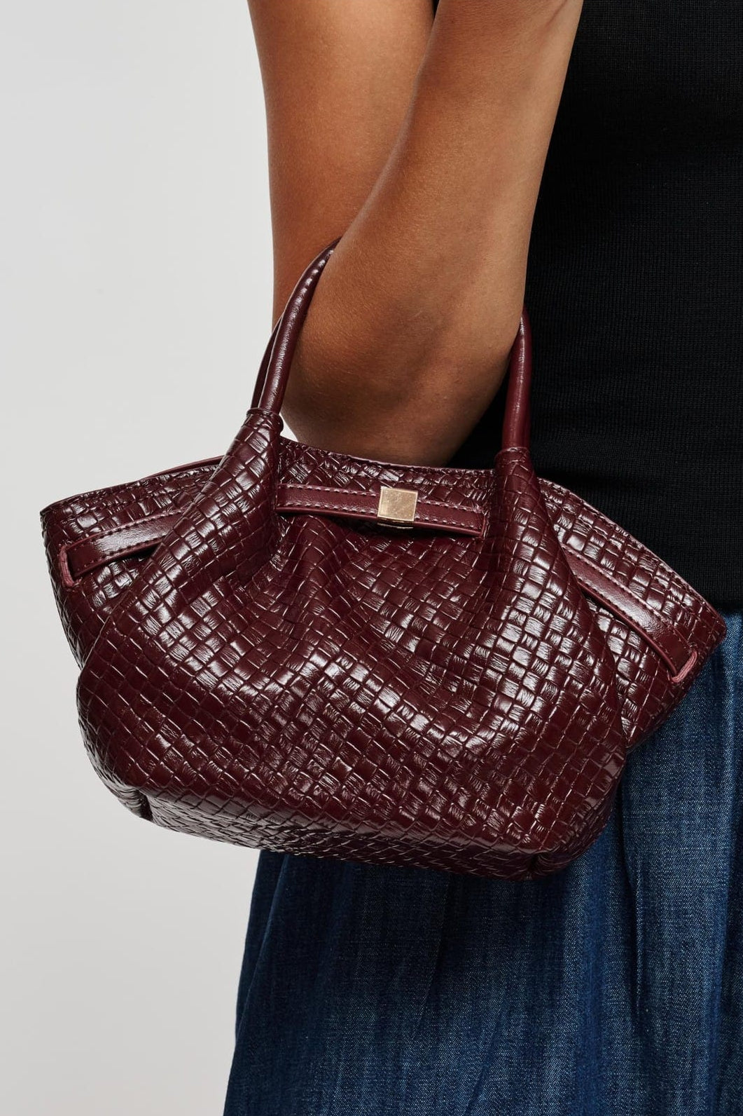 63032BEW Burgundy bag styled on model, view 1