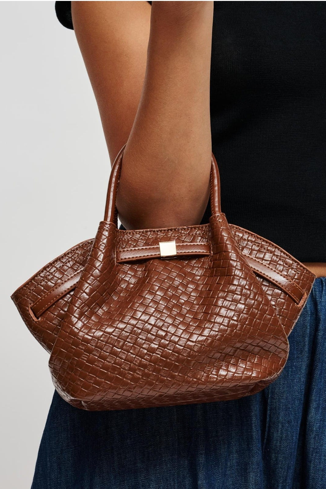 63032BEW Cognac bag styled on model, view 1